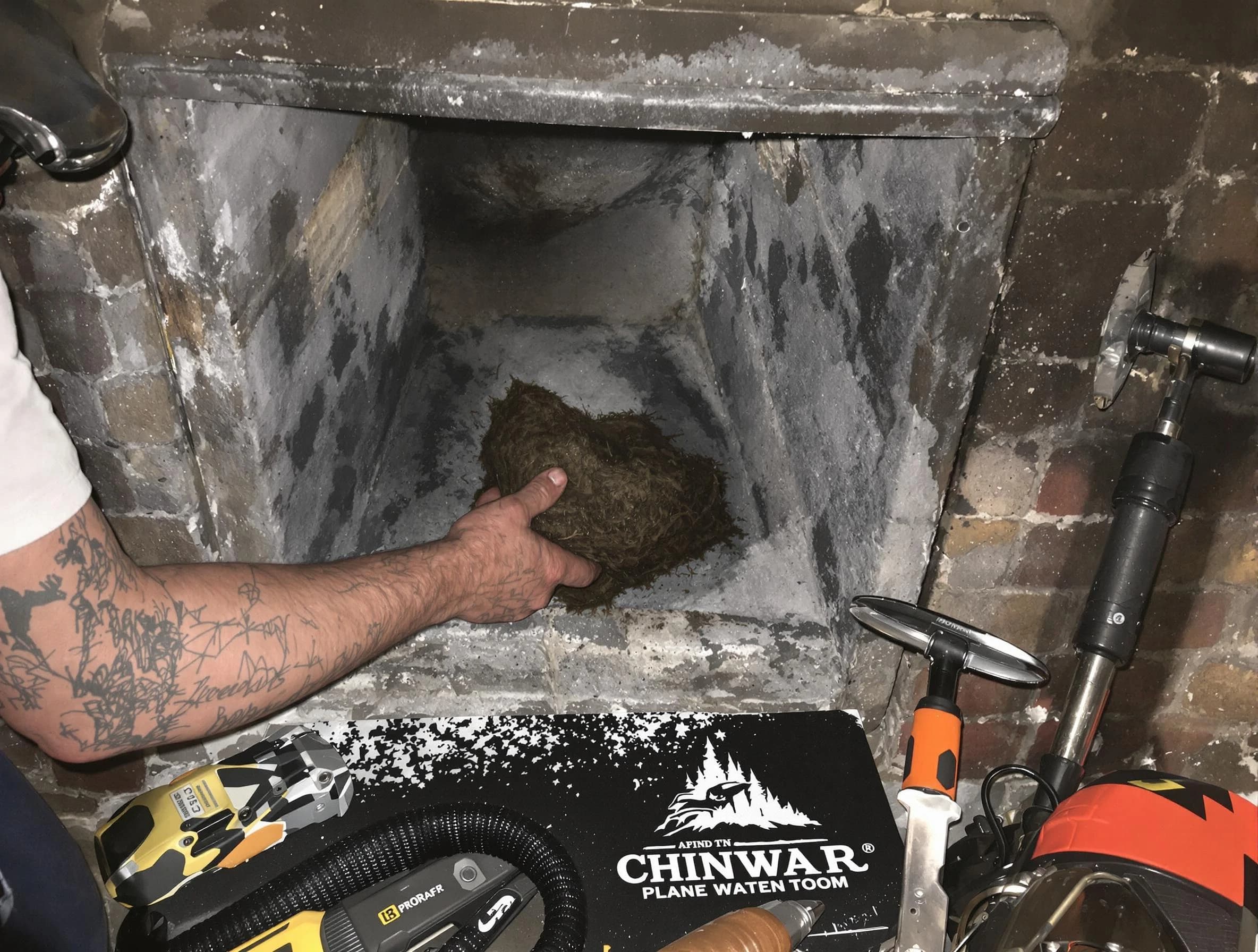 Jasper Chimney Sweep safely removing debris and screening chimney in Jasper, AL